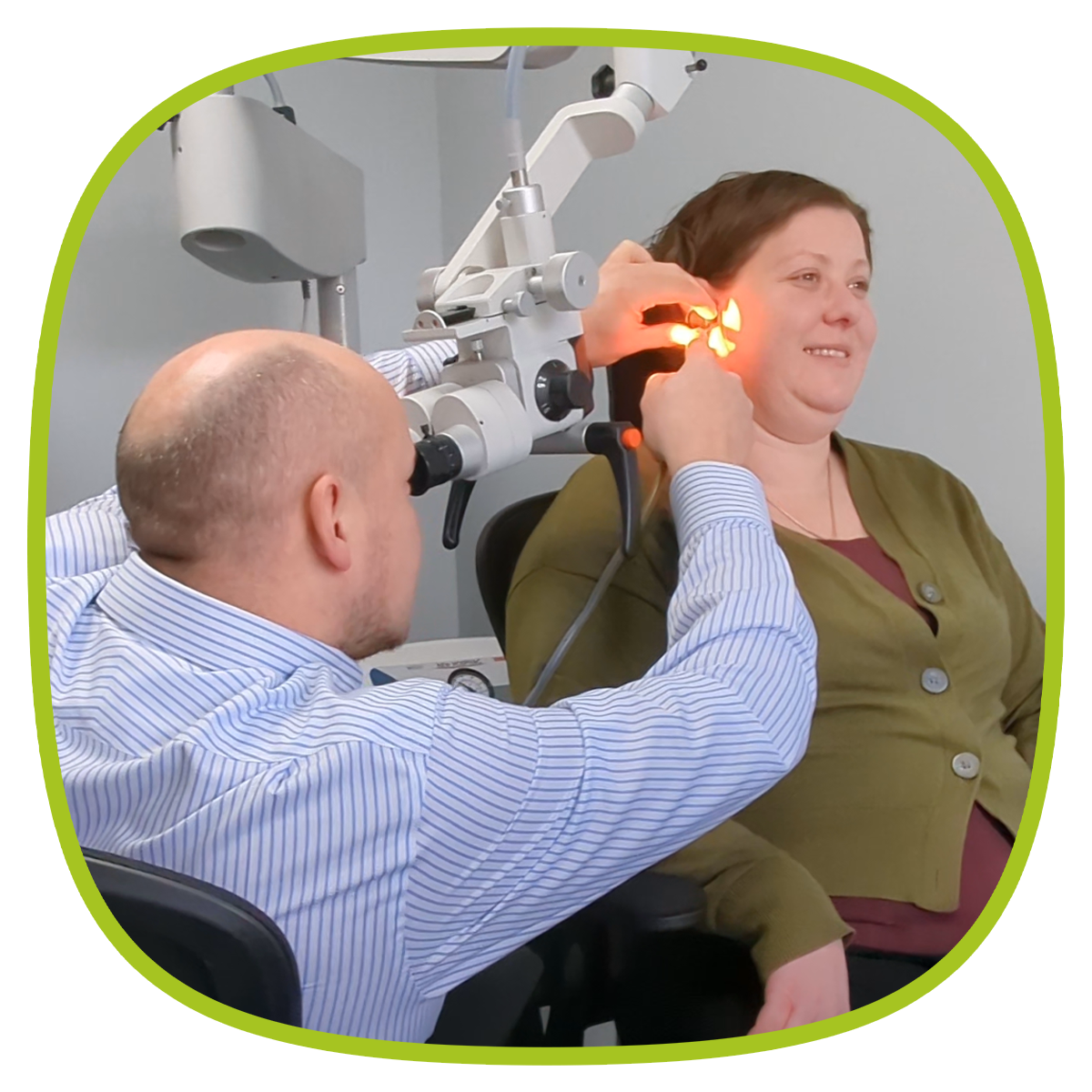 Microsuction earwax removal being performed